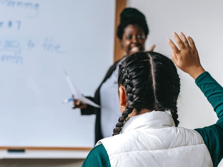 Teacher calling on a student to answer a question