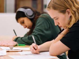 Students completing classwork in class