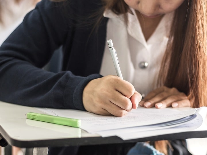 Student writing an in-class essay