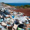 Piles of discarded garbage along a beach