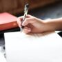 Woman reflecting in a journal