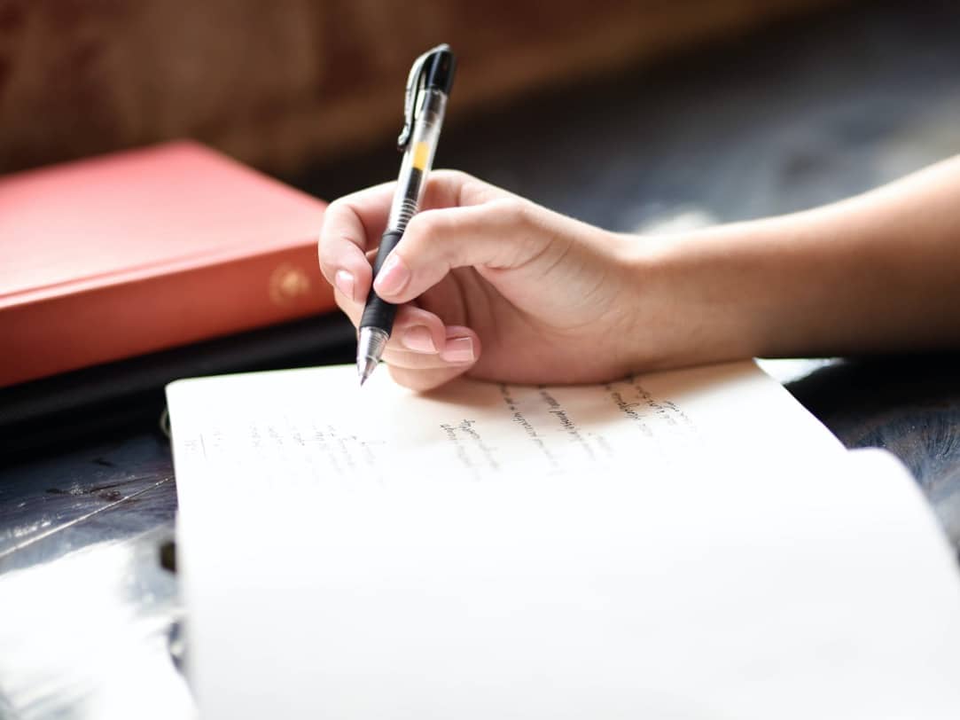 Woman reflecting in a journal