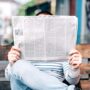 Person reading the newspaper