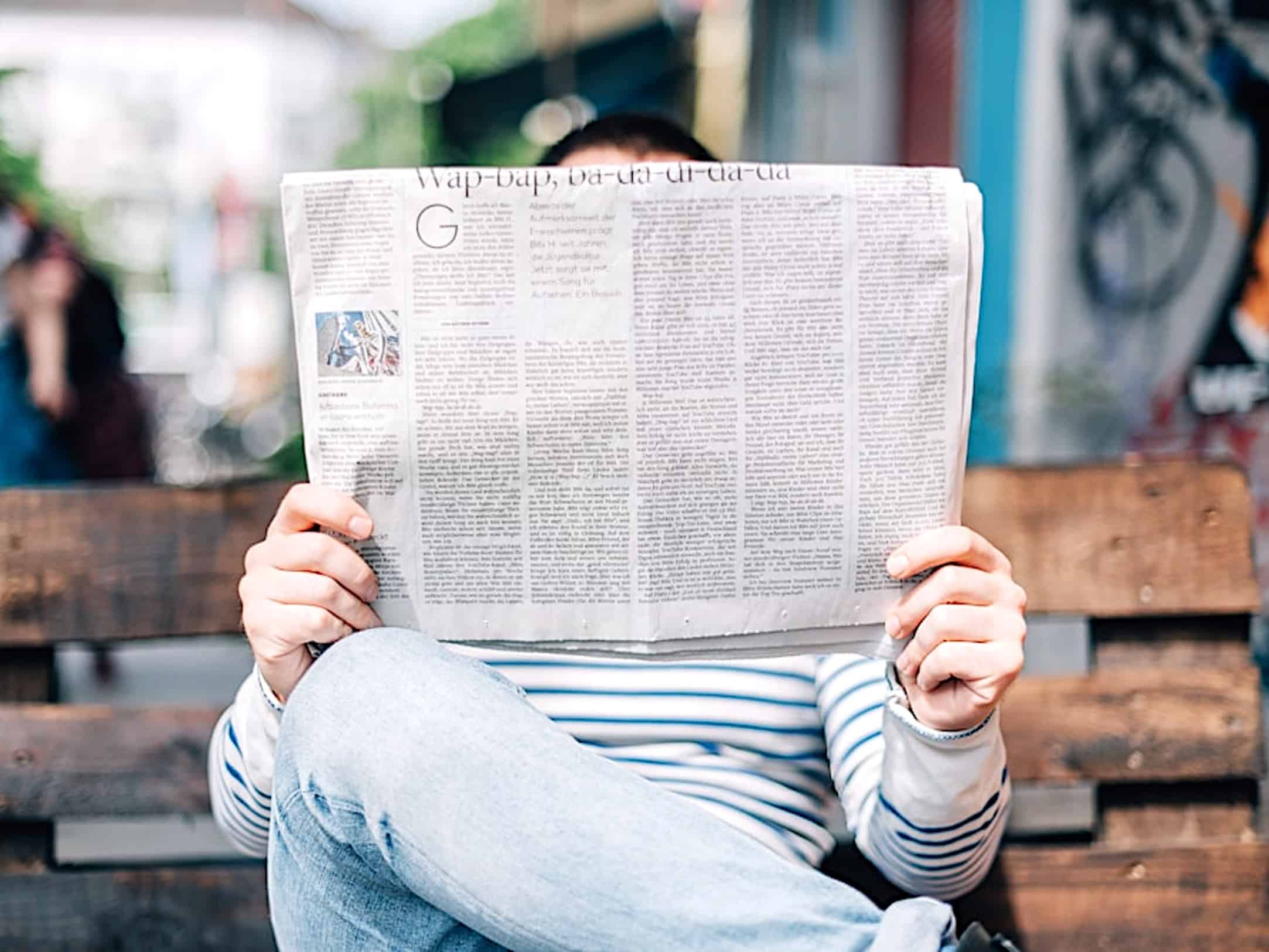 Person reading the newspaper