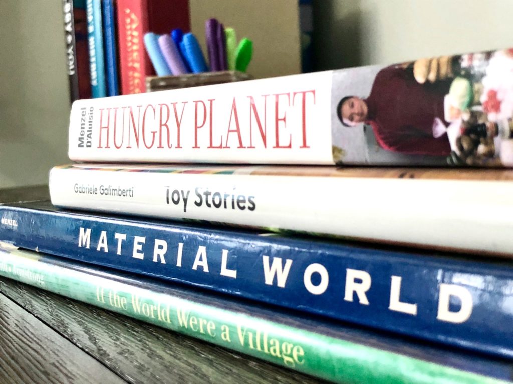 Stack of photography books on world poverty