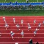 Aerial shot of cheerleaders on the track at a football game