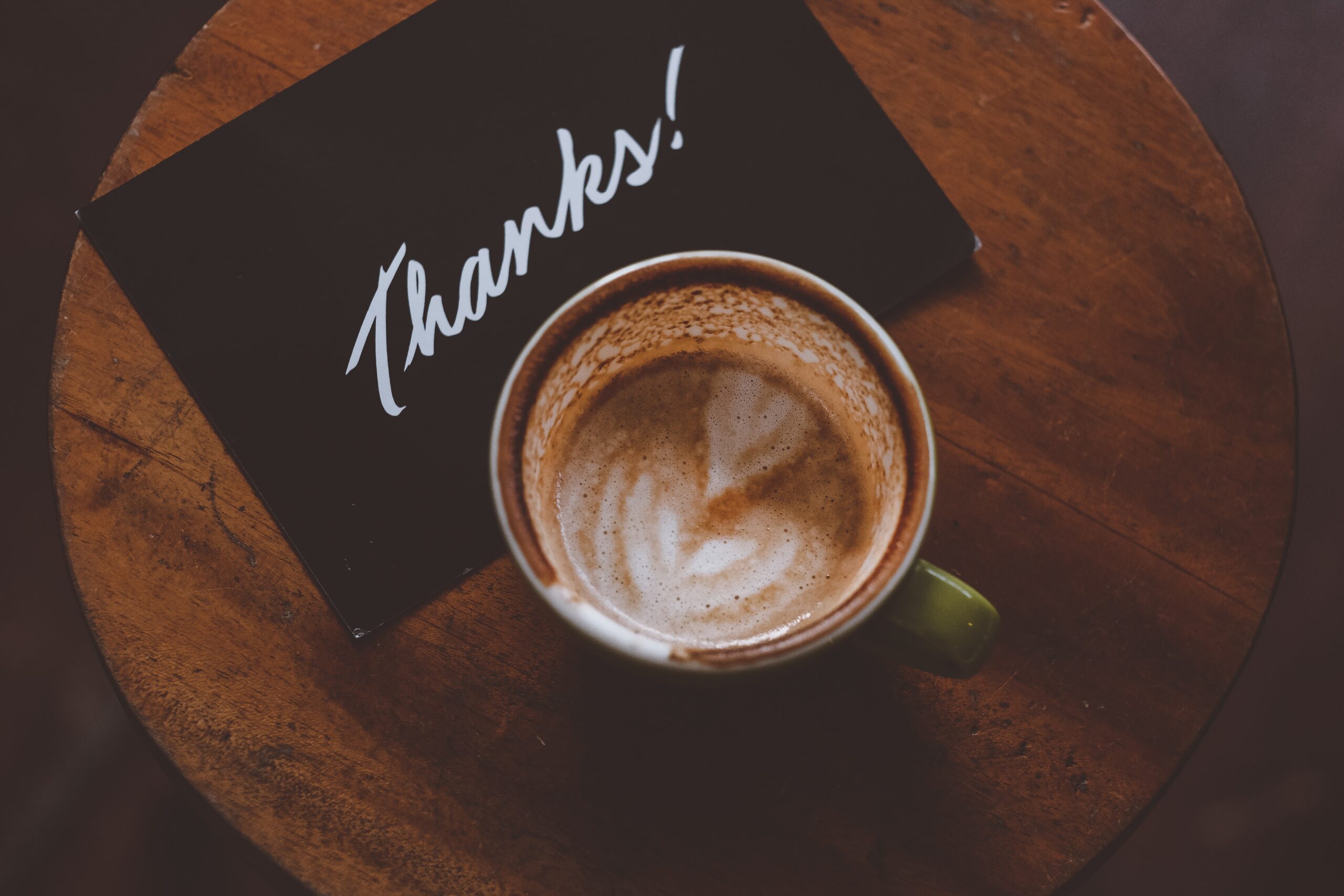 Thank You Card and cup of coffee on a table