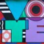 Multicolored mural with “vote” in big letters
