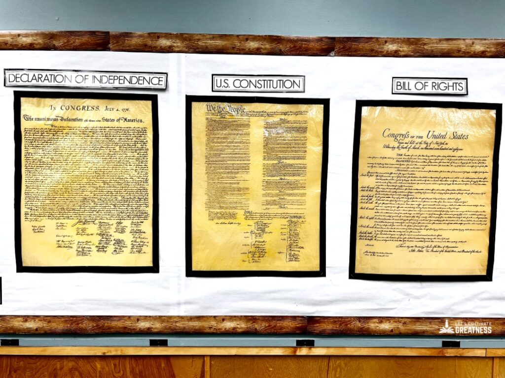 Declaration of Independence, US Constitution, and Bill of Rights displayed on a classroom wall