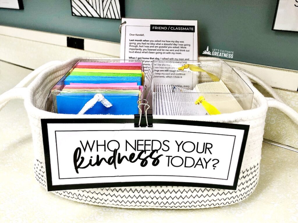 A basket filled with note cards sitting on a classroom counter 