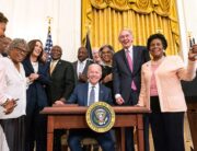 President Biden signing a bill into law
