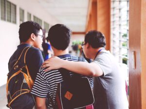 Teacher talking with students